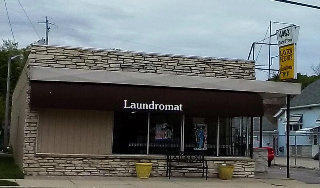 Exterior storefront of Layton Heights Laundromat